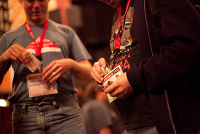 Attendees storing cards in their badge holders